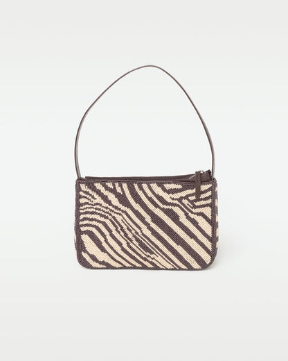 Off-model front view of the animal print Alora Bag.