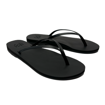 Lux Noir minimalist flip flop with thin strap and arch support in black