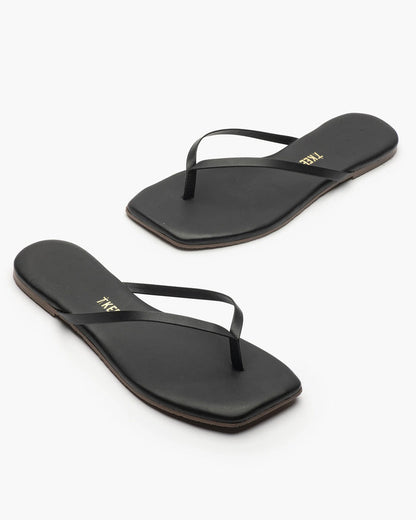 Off-model angled view of the TKEES Square Toe Lily Sandals in black.